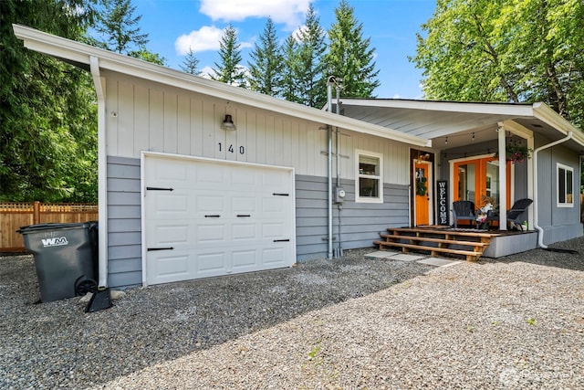 140 Tremont St, Port Orchard, WA 98366 - view of front of house with a garage, covered porch, and gravel driveway