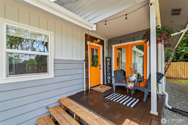 140 Tremont St, Port Orchard, WA 98366 - entrance to property with covered porch, a surveillance system, and french doors