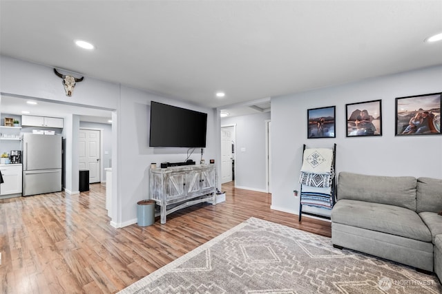 140 Tremont St, Port Orchard, WA 98366 - living area with light wood-style flooring, baseboards, and recessed lighting