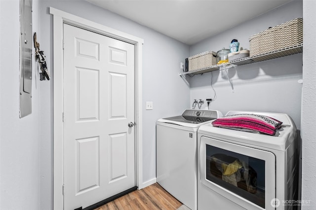 140 Tremont St, Port Orchard, WA 98366 - laundry area featuring independent washer and dryer and light wood-style flooring