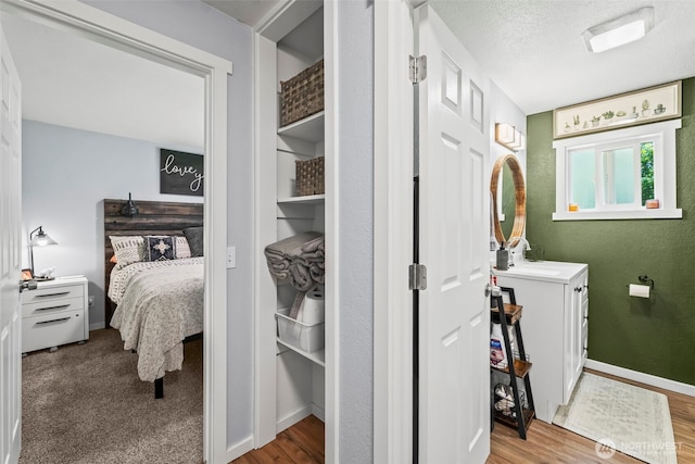 140 Tremont St, Port Orchard, WA 98366 - bathroom with vanity, wood finished floors, baseboards, and ensuite bath