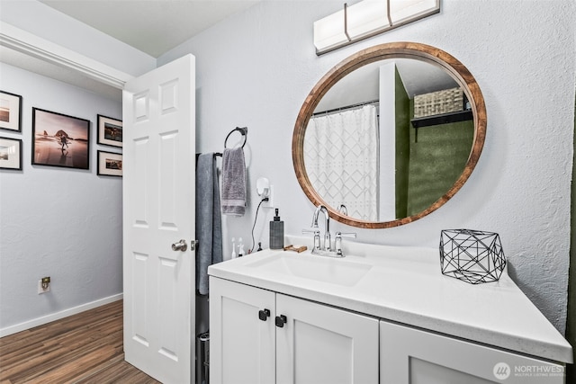 140 Tremont St, Port Orchard, WA 98366 - full bathroom with vanity, wood finished floors, and baseboards