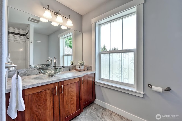 936 W Axton Rd, Bellingham, WA 98226 - full bathroom with baseboards, vanity, and marble finish floors