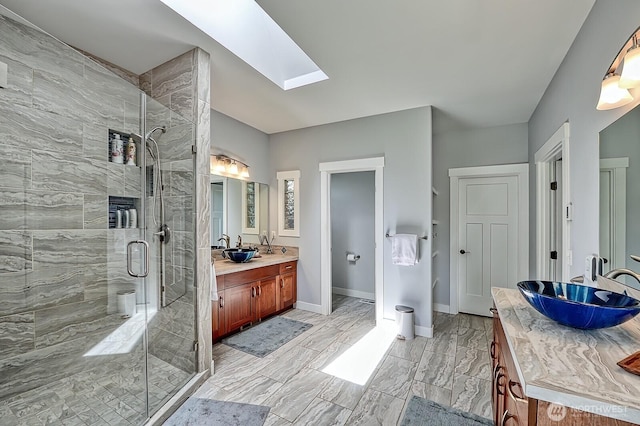 936 W Axton Rd, Bellingham, WA 98226 - bathroom with a skylight, vanity, a stall shower, and baseboards