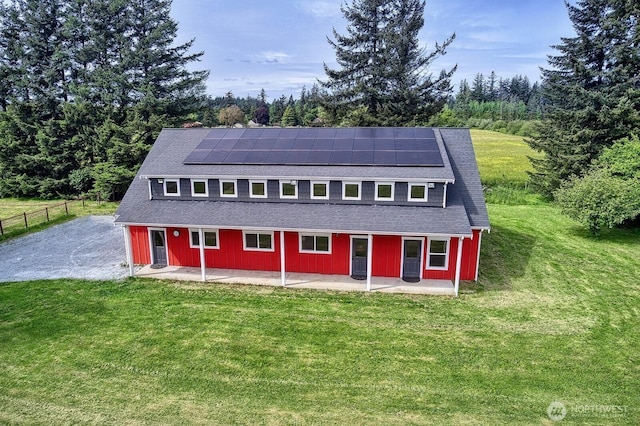 936 W Axton Rd, Bellingham, WA 98226 - view of front facade with a patio area, solar panels, and a shingled roof