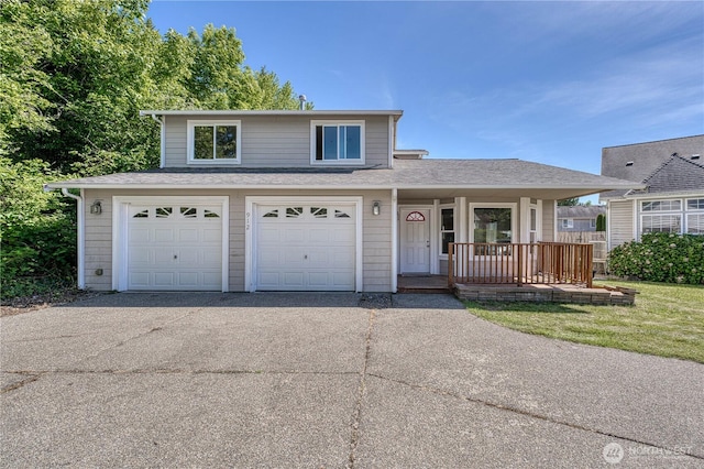 912 Eagle Crest Pl, Port Orchard, WA 98366 - traditional-style home with driveway, covered porch, an attached garage, and roof with shingles