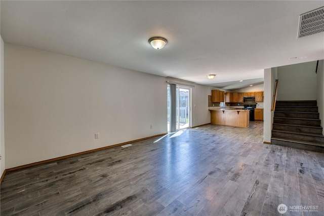 912 Eagle Crest Pl, Port Orchard, WA 98366 - unfurnished living room featuring baseboards, wood finished floors, and stairway