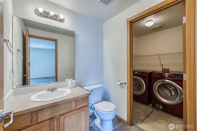 912 Eagle Crest Pl, Port Orchard, WA 98366 - bathroom with washer and dryer, vanity, toilet, and tile patterned floors
