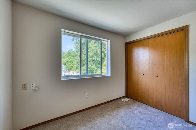 912 Eagle Crest Pl, Port Orchard, WA 98366 - unfurnished bedroom featuring carpet, a closet, and baseboards