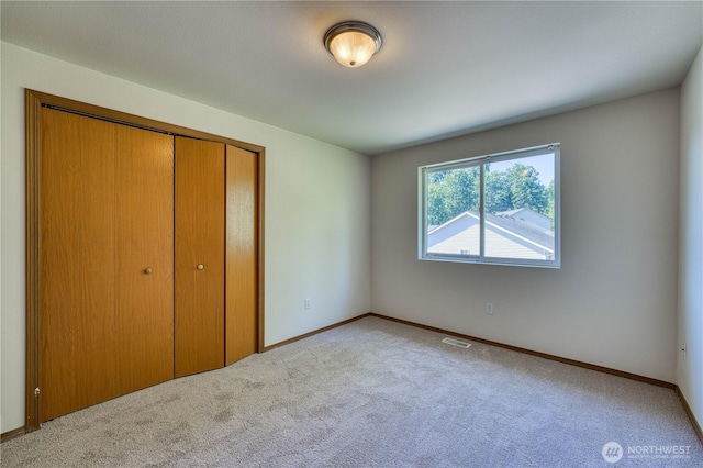 912 Eagle Crest Pl, Port Orchard, WA 98366 - unfurnished bedroom with carpet flooring, a closet, and baseboards