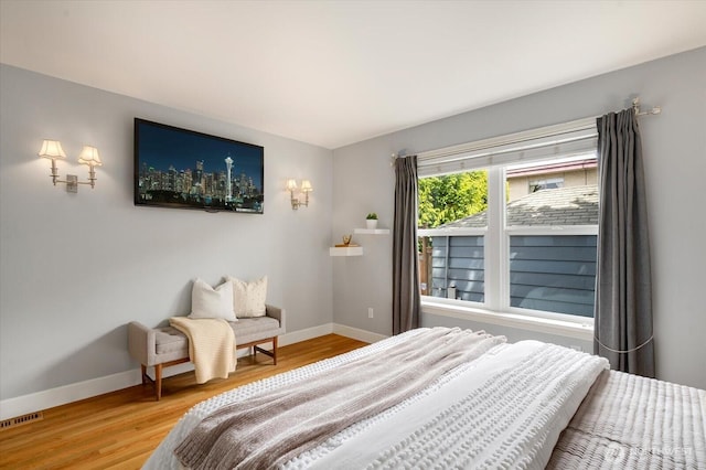 7530 25th Ave NW, Seattle, WA 98117 - bedroom featuring baseboards and wood finished floors