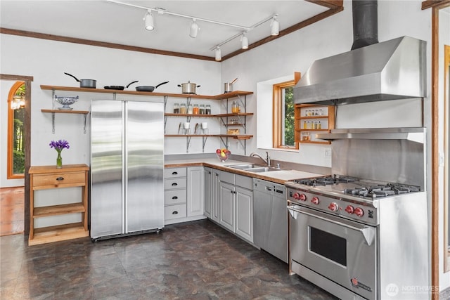 160 Bywater Way, Port Ludlow, WA 98365 - kitchen featuring open shelves, appliances with stainless steel finishes, wall chimney range hood, a sink, and light countertops