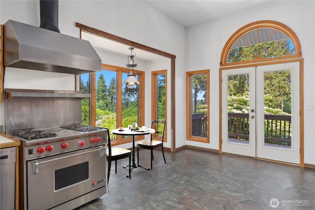 160 Bywater Way, Port Ludlow, WA 98365 - kitchen with wall chimney exhaust hood, stainless steel appliances, decorative light fixtures, and baseboards