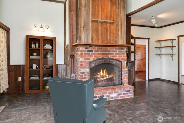 160 Bywater Way, Port Ludlow, WA 98365 - living room featuring a brick fireplace, a wainscoted wall, and wood walls