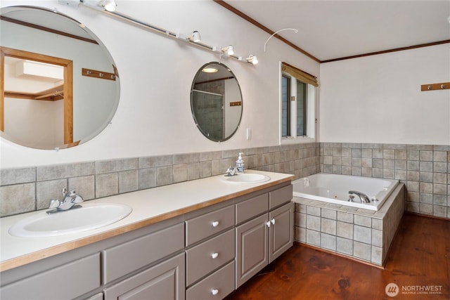 160 Bywater Way, Port Ludlow, WA 98365 - bathroom with double vanity, wood finished floors, a tub with jets, crown molding, and a shower