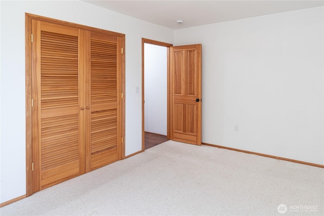 160 Bywater Way, Port Ludlow, WA 98365 - unfurnished bedroom featuring carpet floors, a closet, and baseboards