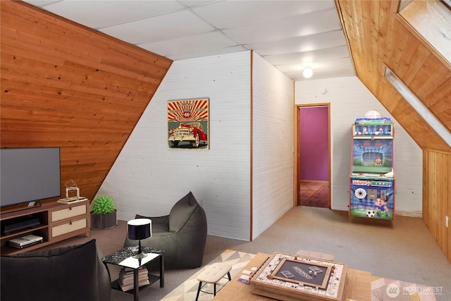 160 Bywater Way, Port Ludlow, WA 98365 - living room featuring wooden walls, carpet floors, and vaulted ceiling