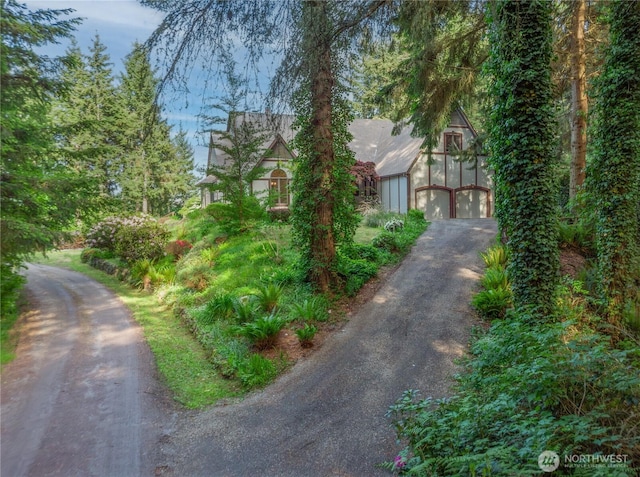 160 Bywater Way, Port Ludlow, WA 98365 - view of front facade featuring asphalt driveway and a garage