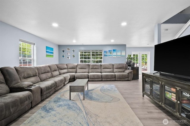 20723 197th Ave E, Orting, WA 98360 - living area featuring wood finished floors, recessed lighting, healthy amount of natural light, and french doors