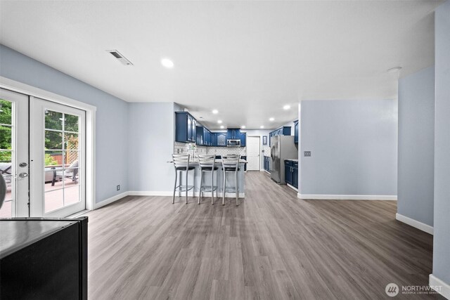 20723 197th Ave E, Orting, WA 98360 - living room featuring recessed lighting, light wood-type flooring, and baseboards