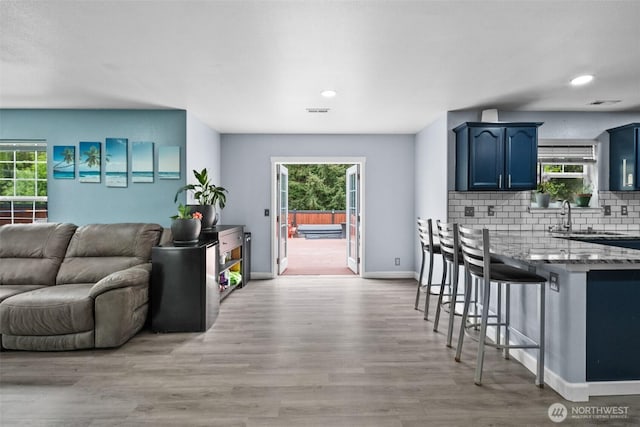 20723 197th Ave E, Orting, WA 98360 - living room with healthy amount of natural light, light wood-style flooring, baseboards, and recessed lighting
