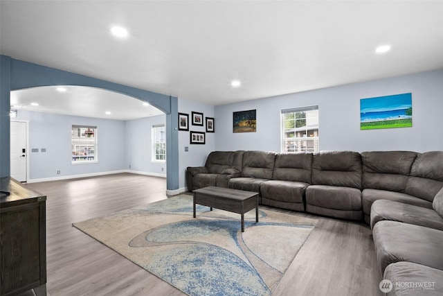 20723 197th Ave E, Orting, WA 98360 - living area with arched walkways, wood finished floors, recessed lighting, and baseboards