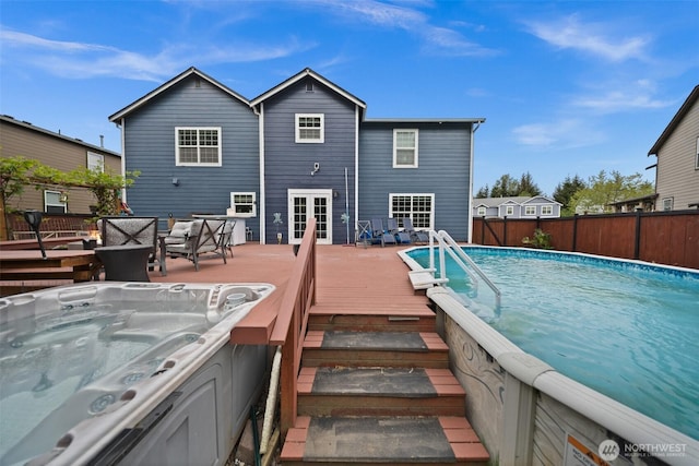 20723 197th Ave E, Orting, WA 98360 - rear view of house featuring a wooden deck, an outdoor hot tub, and french doors