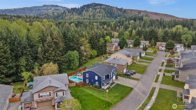 20723 197th Ave E, Orting, WA 98360 - aerial view of residential area featuring a heavily wooded area and a mountainous background