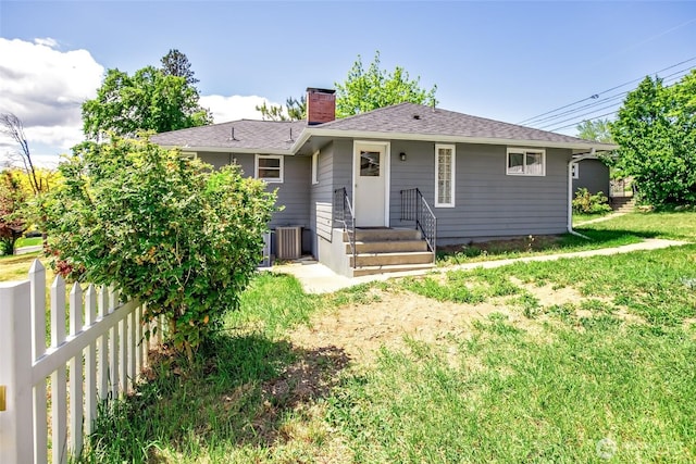 813 E 3rd Ave, Ellensburg, WA 98926 - view of front of house with a chimney and cooling unit