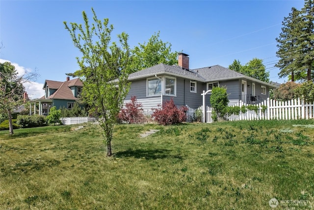 813 E 3rd Ave, Ellensburg, WA 98926 - view of side of property featuring a chimney and a shingled roof