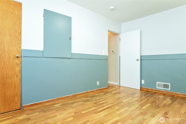 813 E 3rd Ave, Ellensburg, WA 98926 - unfurnished room with wood finished floors and baseboards