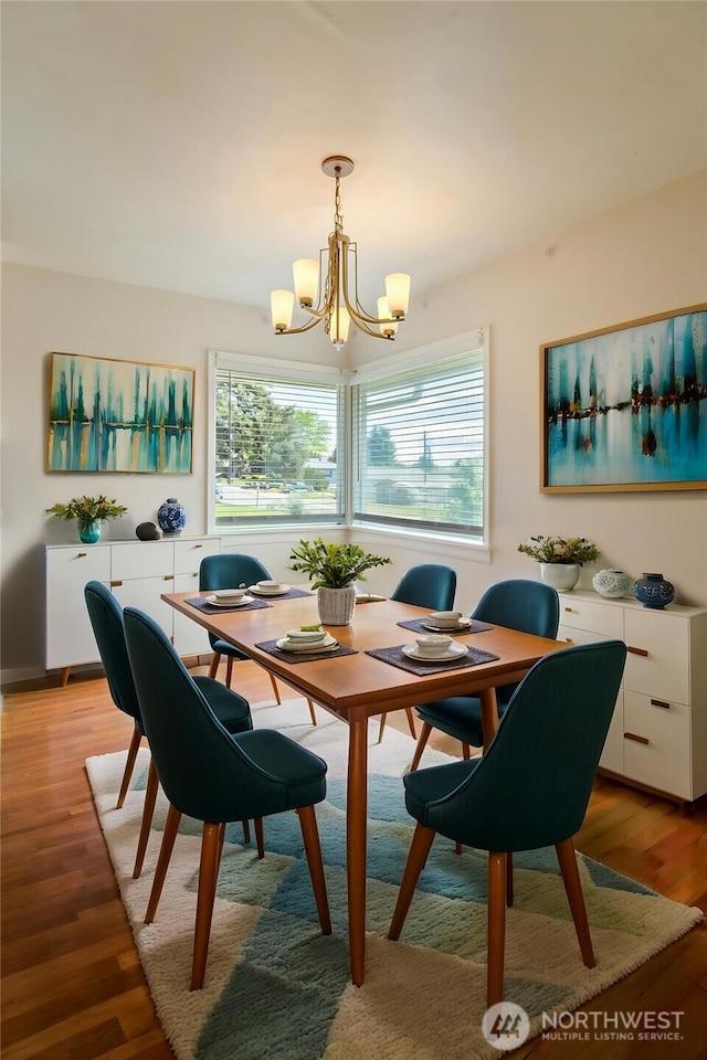 813 E 3rd Ave, Ellensburg, WA 98926 - dining area with a chandelier, healthy amount of natural light, and light wood-style flooring