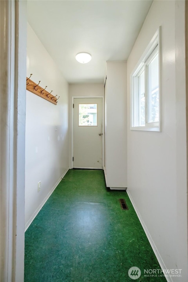 813 E 3rd Ave, Ellensburg, WA 98926 - doorway with baseboards and carpet