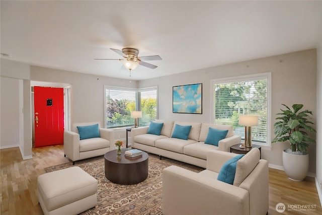 813 E 3rd Ave, Ellensburg, WA 98926 - living room with wood finished floors, a ceiling fan, and baseboards