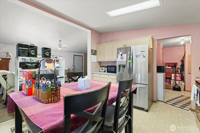 741 Twin Lakes Rd, Cle Elum, WA 98922 - kitchen with stainless steel fridge with ice dispenser, black microwave, washer / clothes dryer, a ceiling fan, and cream cabinets