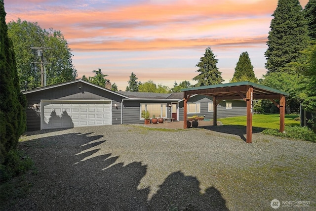 11112 E Riverside Dr, Bothell, WA 98011 - view of front of property featuring gravel driveway, an attached garage, and a carport