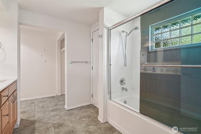 11112 E Riverside Dr, Bothell, WA 98011 - bathroom featuring vanity, bath / shower combo with glass door, and baseboards
