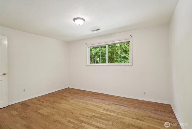 11112 E Riverside Dr, Bothell, WA 98011 - empty room featuring light wood-type flooring and baseboards