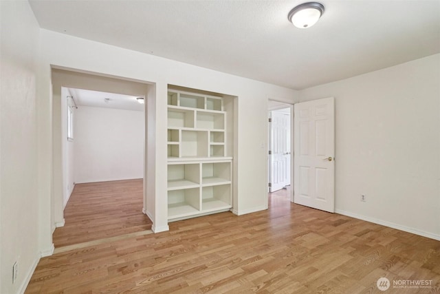11112 E Riverside Dr, Bothell, WA 98011 - unfurnished bedroom with light wood-style floors and baseboards