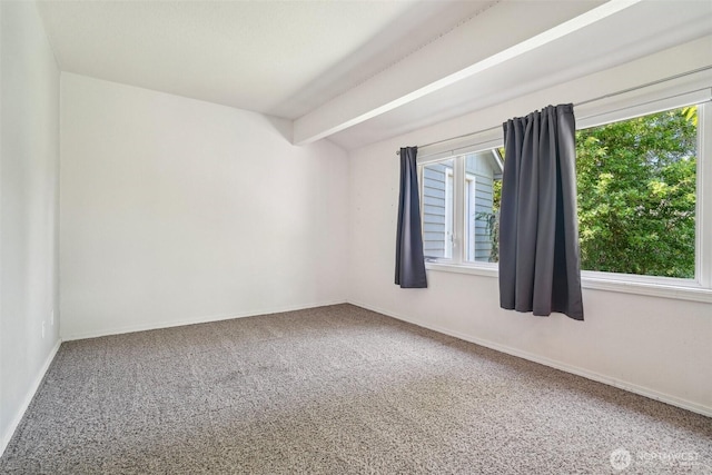 11112 E Riverside Dr, Bothell, WA 98011 - carpeted empty room featuring baseboards and beam ceiling