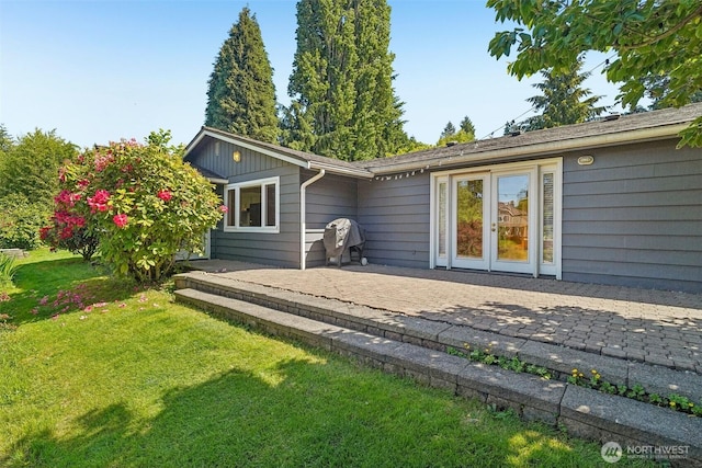 11112 E Riverside Dr, Bothell, WA 98011 - back of property featuring a patio area and a yard