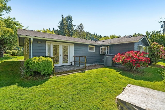 11112 E Riverside Dr, Bothell, WA 98011 - back of property with central air condition unit, a lawn, and french doors