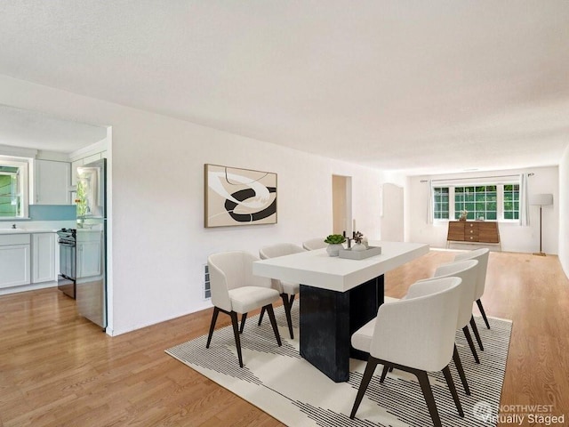 11112 E Riverside Dr, Bothell, WA 98011 - dining room with light wood-style flooring