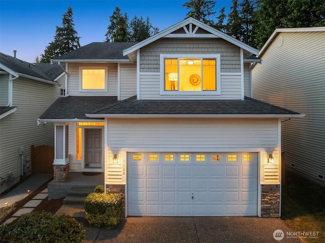 7522 NE 204th Pl, Kenmore, WA 98028 - craftsman-style home featuring stone siding, an attached garage, a shingled roof, and driveway