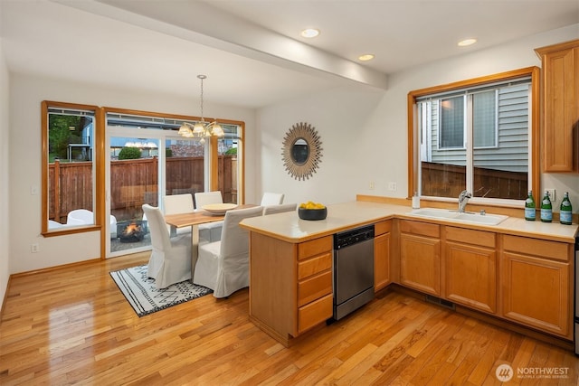 7522 NE 204th Pl, Kenmore, WA 98028 - kitchen featuring dishwasher, a sink, light wood-type flooring, a chandelier, and a peninsula