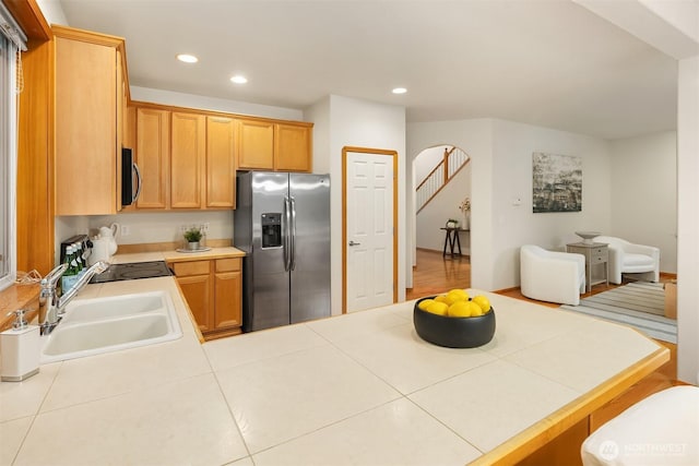 7522 NE 204th Pl, Kenmore, WA 98028 - kitchen featuring appliances with stainless steel finishes, a sink, a peninsula, recessed lighting, and tile countertops