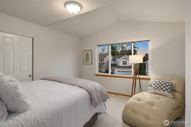 7522 NE 204th Pl, Kenmore, WA 98028 - carpeted bedroom featuring vaulted ceiling and baseboards