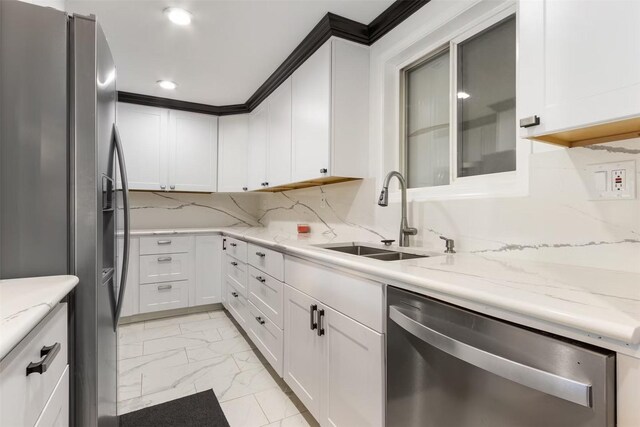 5004 188th St SW, Lynnwood, WA 98037 - kitchen featuring appliances with stainless steel finishes, a sink, light marble finish flooring, white cabinets, and recessed lighting