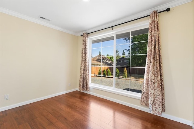 5004 188th St SW, Lynnwood, WA 98037 - empty room with crown molding, dark wood-style floors, baseboards, and plenty of natural light