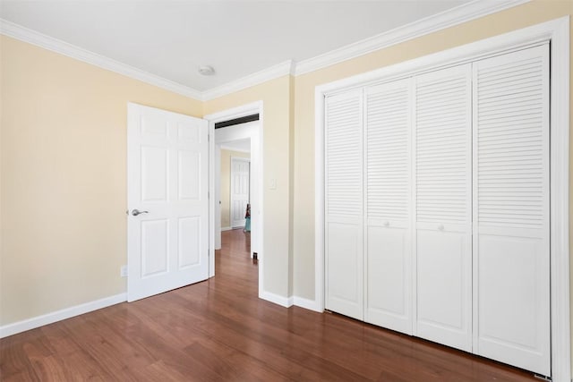 5004 188th St SW, Lynnwood, WA 98037 - unfurnished bedroom with baseboards, dark wood finished floors, ornamental molding, and a closet